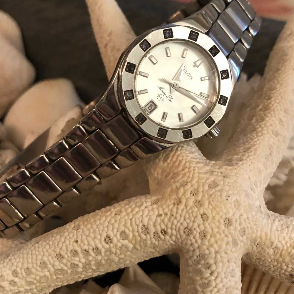 Bulova sterling silver ladies watch.